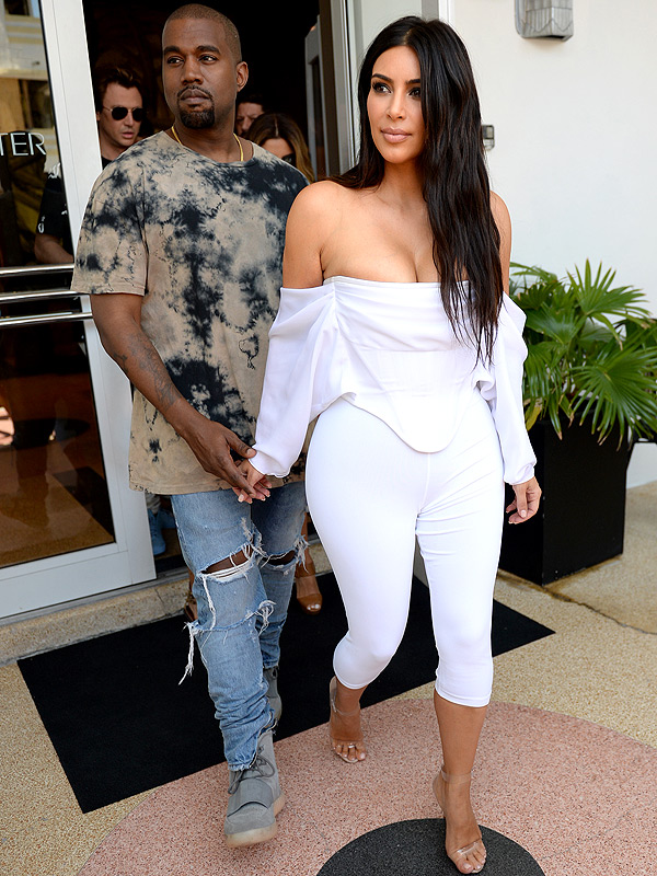 Kim Kardashian off the shoulder white Givenchy pantsuit